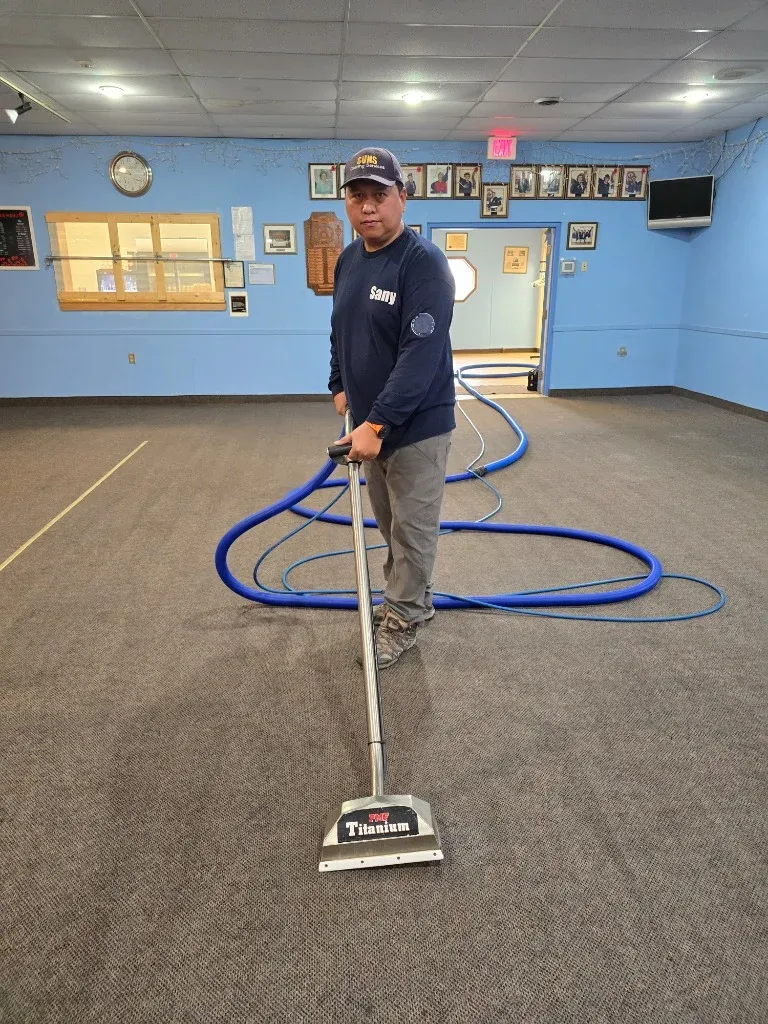 Sany from Suns Cleaning Services cleaning large carpet area